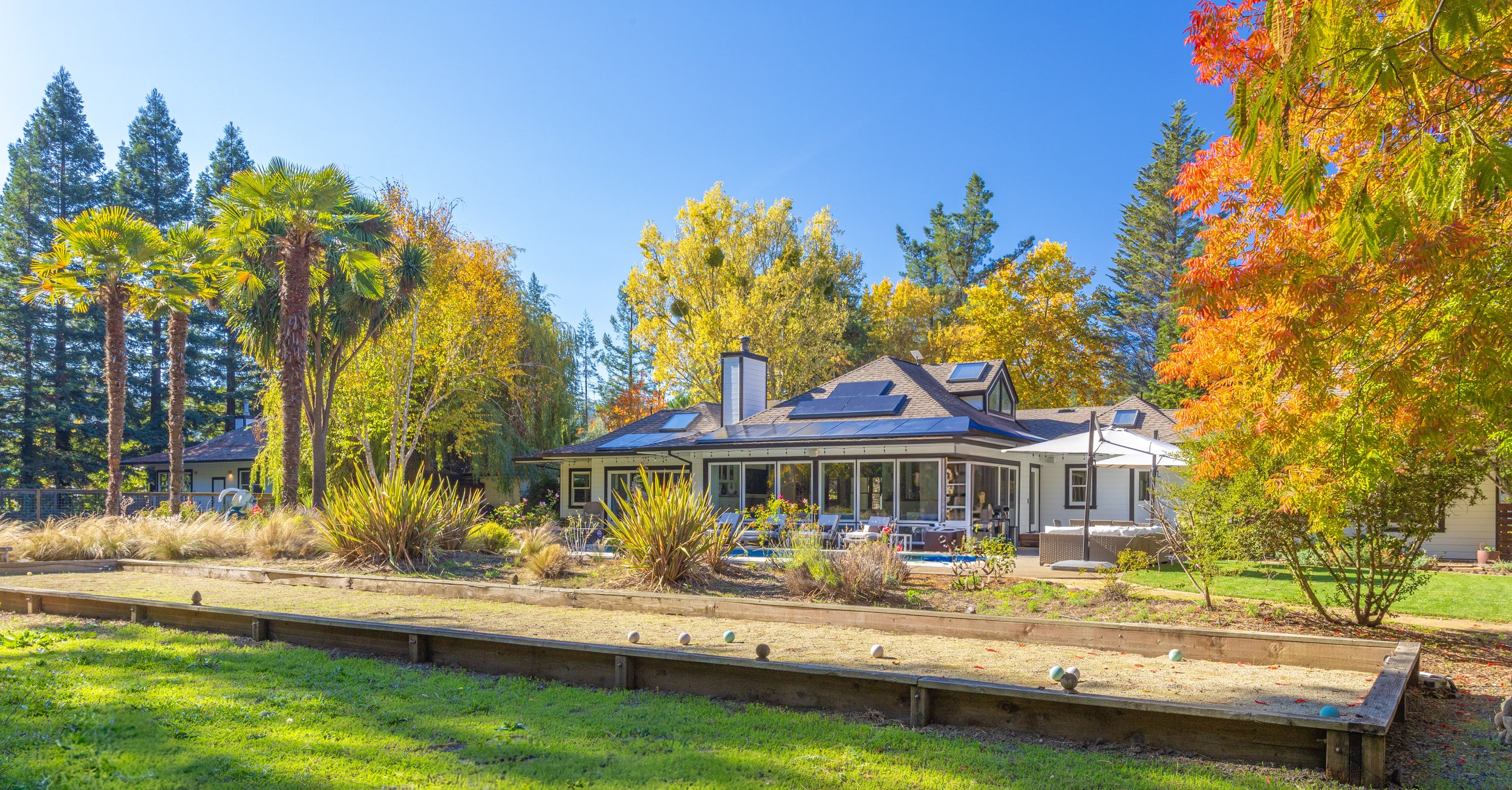 Zegarra Estate farmhouse surrounded by autumn trees