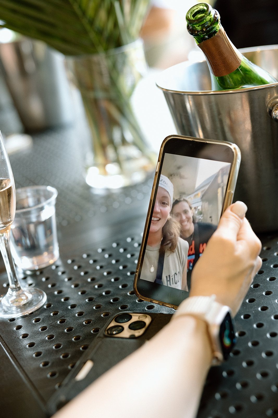 A video call from Sadie and Hannah on a phone at the Korbel table